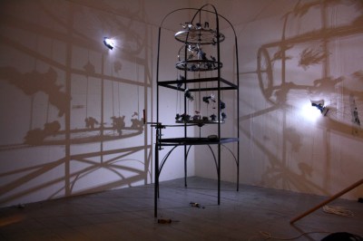 Ben Wayman, Rise/Fall, 2014, 50 x 230 x 70cm, Mild steel, bicycle parts, wax, feathers,  polystyrene, bare bulbs 